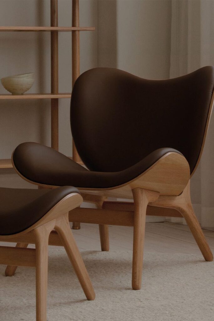 Leather and wood lounge chair with foot stool by Umage
